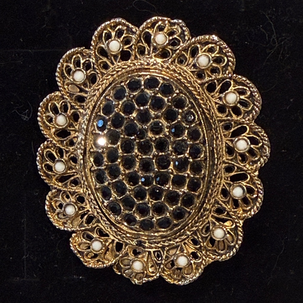 Elegant Gold and Black Filigree Brooch